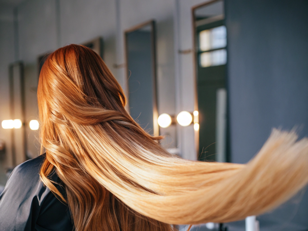 Luxurious dark brown hair on a soft surface, showing silky texture and smoothness